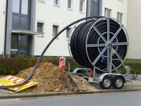 Laying of fiber optic cable in Hanover - Germany, glass fibers are employed as fiber optic cable.
